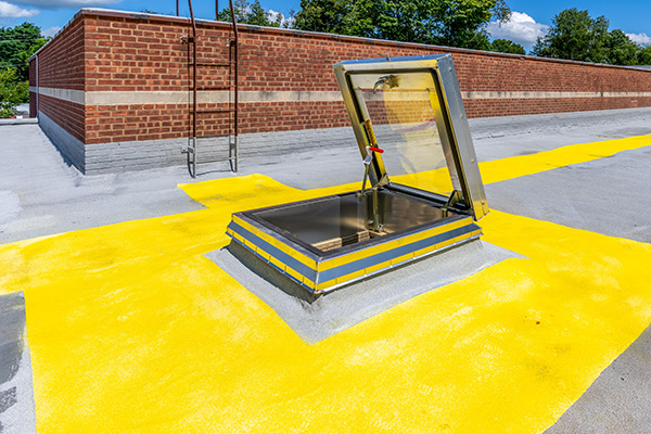 Commercial roof safety: maintaining proper roof hatches and safety rails